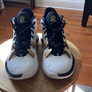 Nike Kyrie White and Black Sneakers with Gold Accents